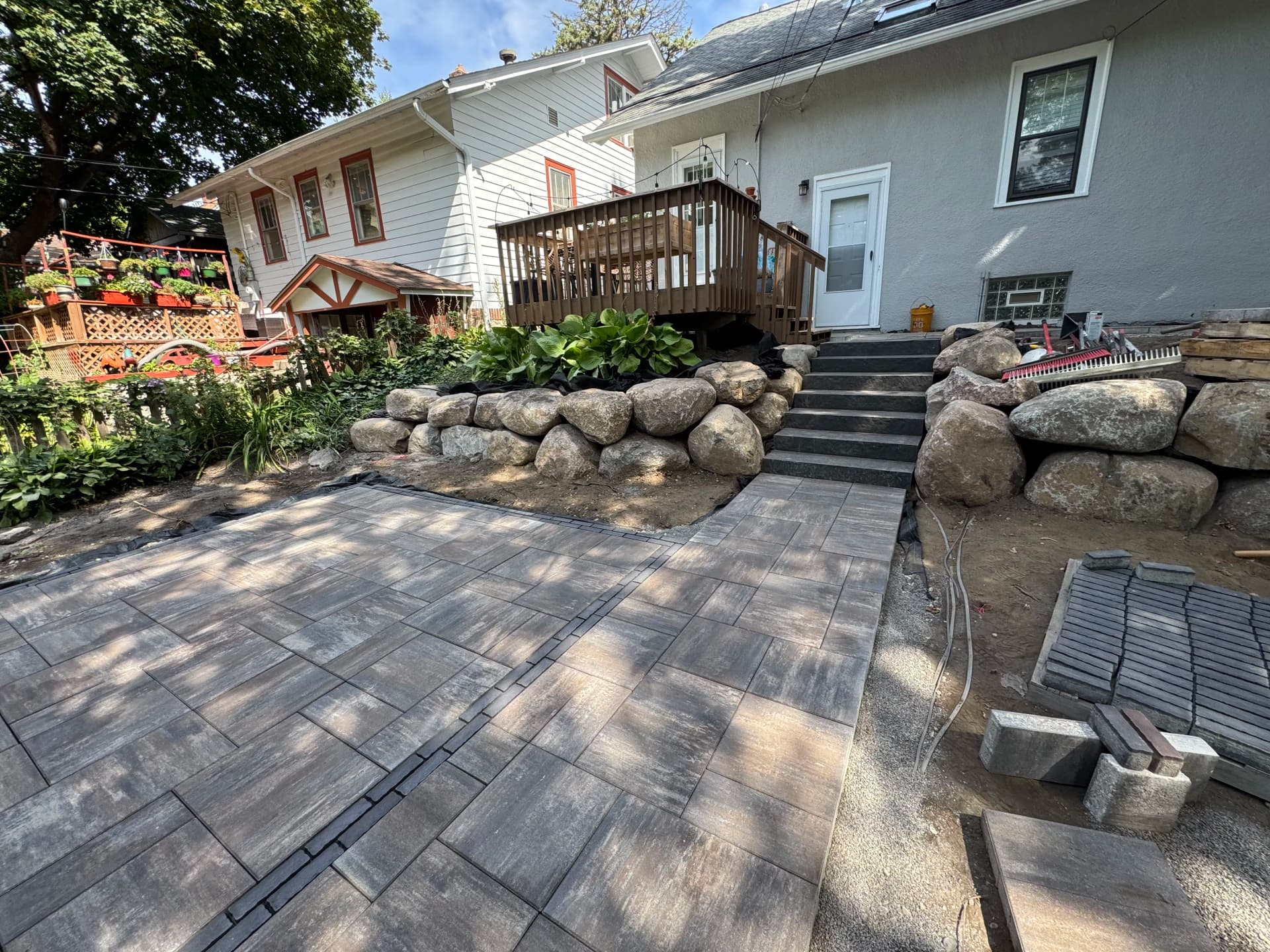 Paver Patios, Boulder Walls, and Full Excavation - Nearly There