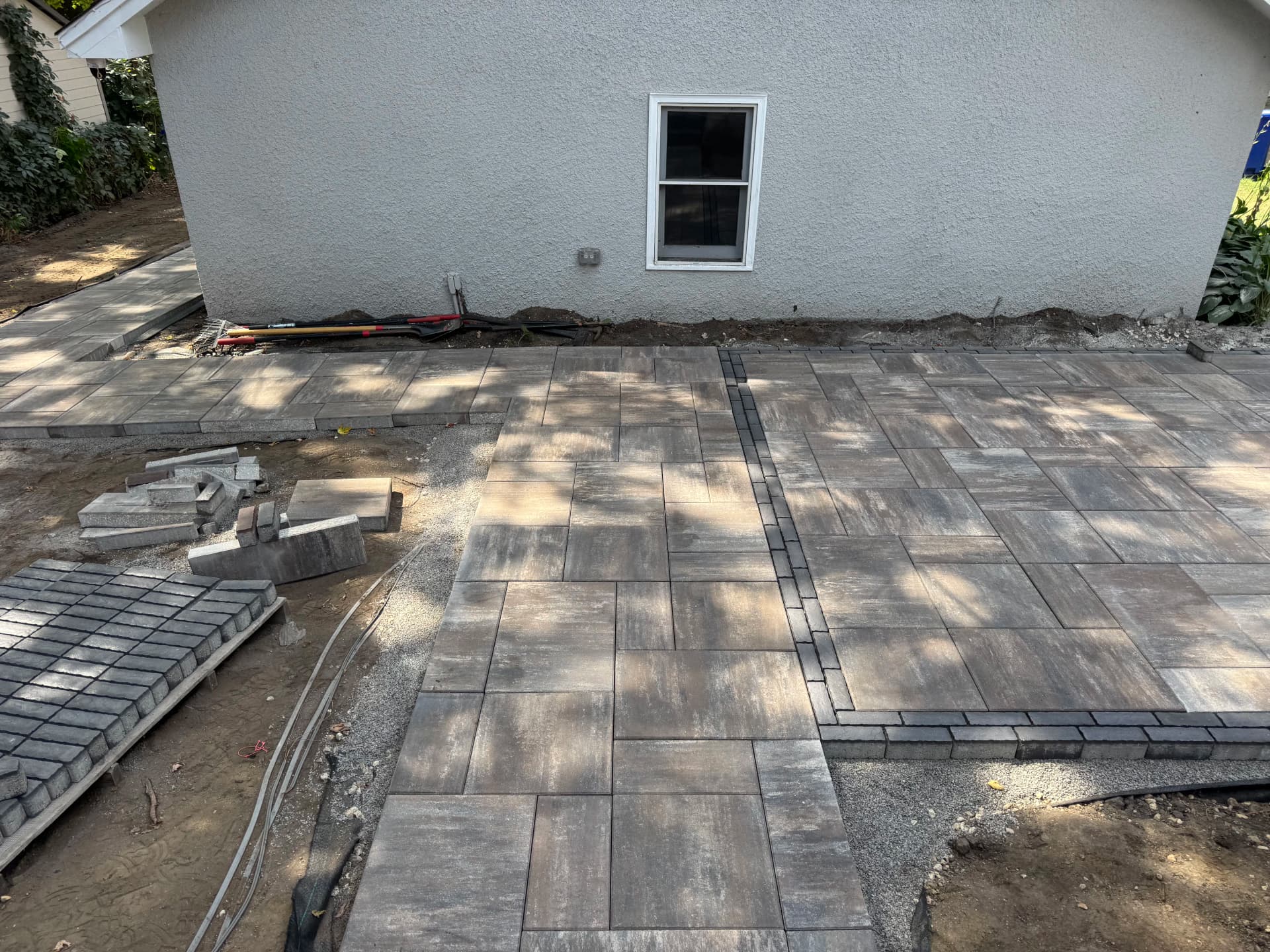 Paver Patios, Boulder Walls, and Full Excavation - Nearly There