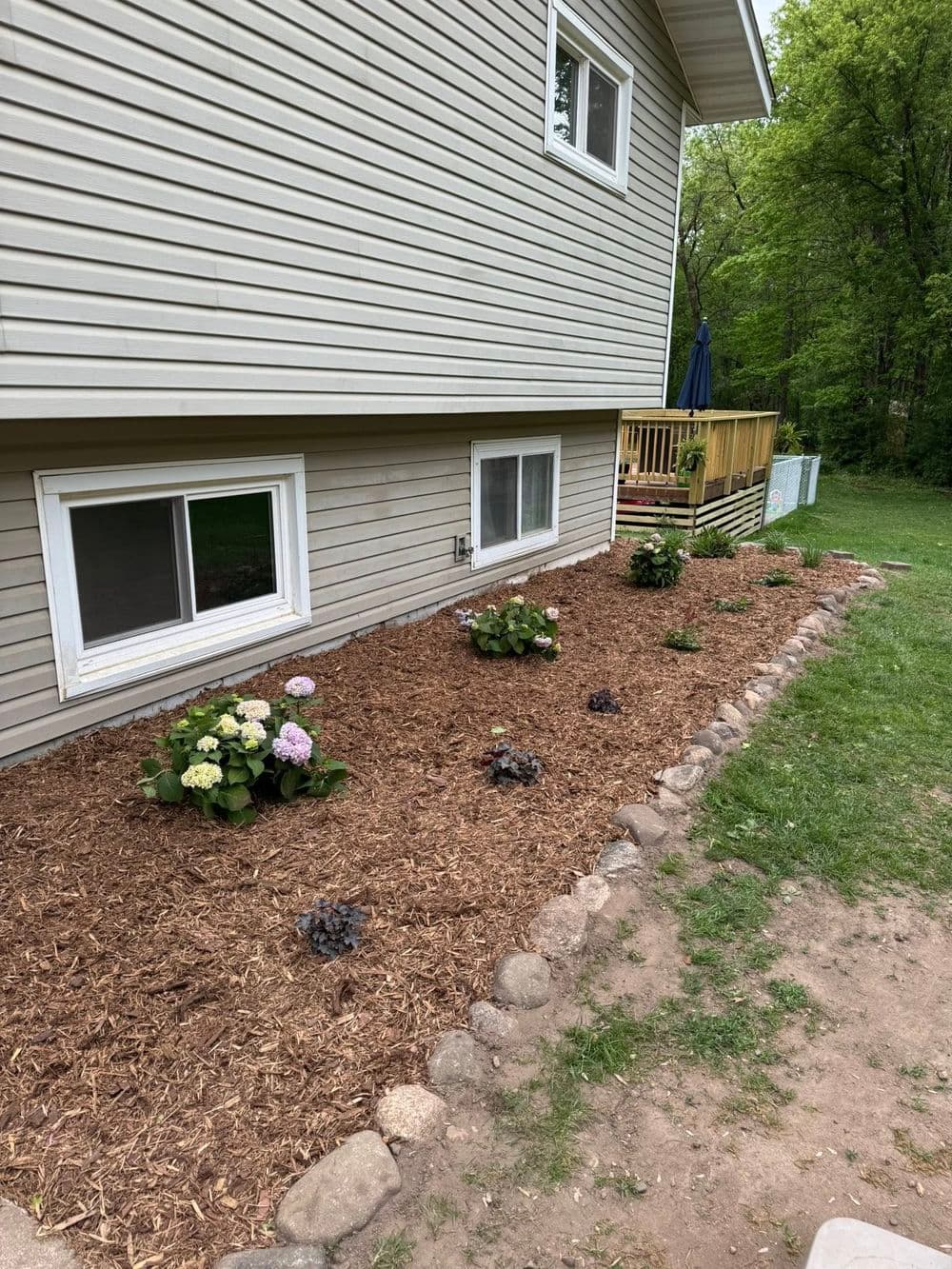 Project Transforming Outdoor Spaces in Roseville MN with Mulch and Boulder Edging image