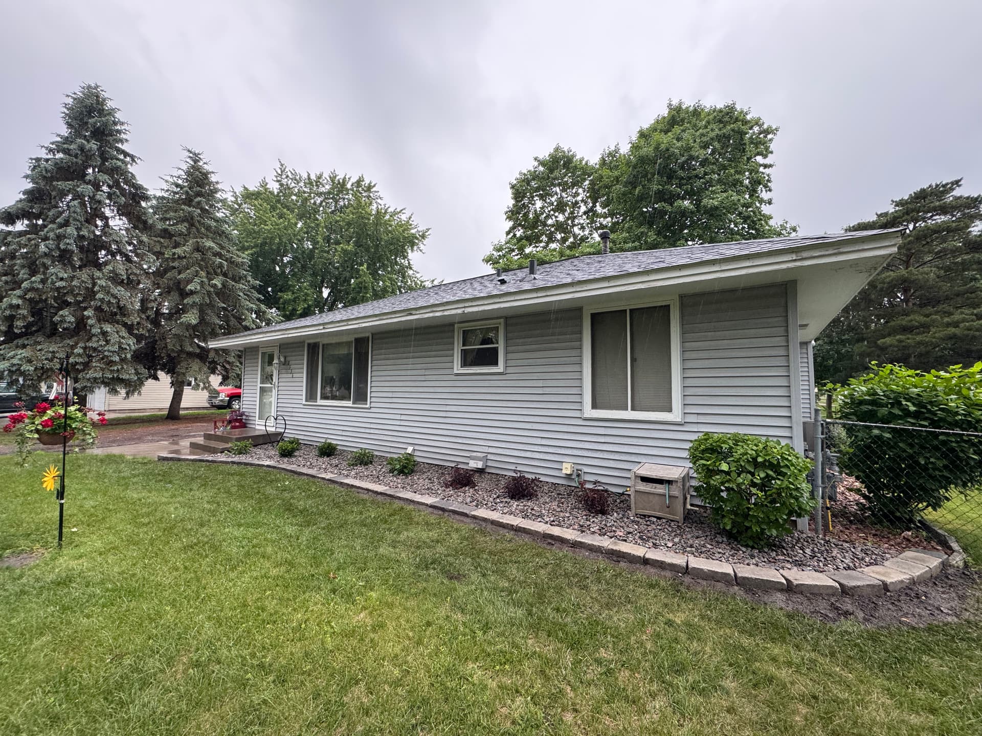 Cottage Grove Garden Bed Cleanup With New Shrubs and Stone image